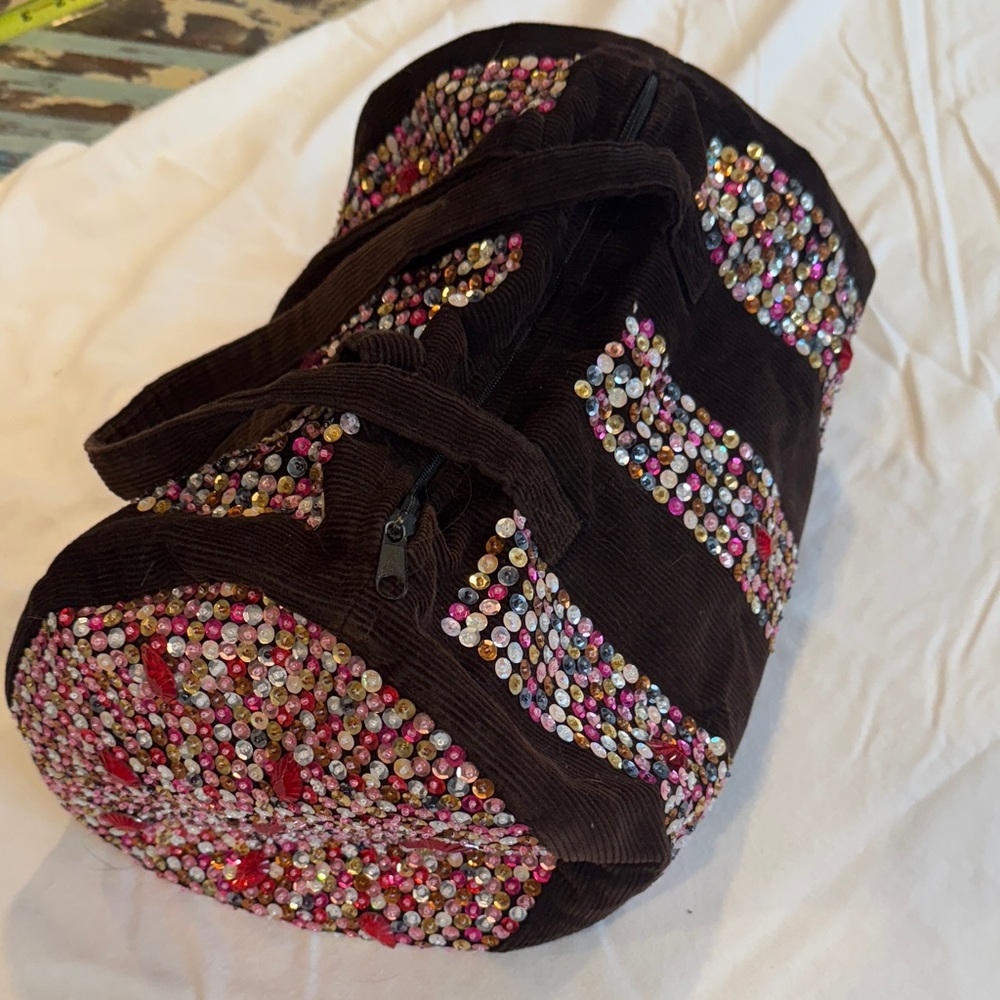 Embellished brown corduroy duffle bag